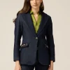 Blazer in denim con catene metalliche