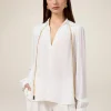 Blusa in tessuto crêpe con catena