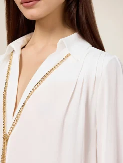 Blusa in tessuto crêpe con catena