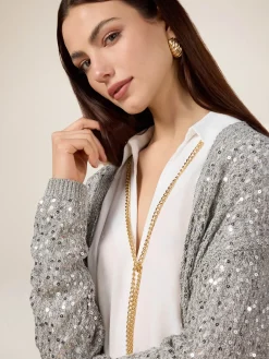 Cardigan traforato con paillettes