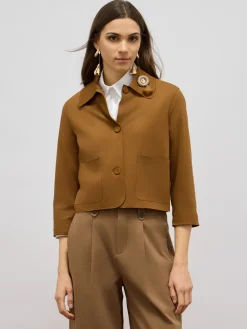 Giacca boxy con spilla gioiello