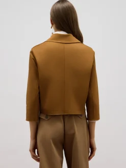 Giacca boxy con spilla gioiello