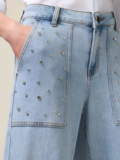 Jeans a palazzo con castoni