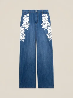 Jeans palazzo con ricami decorativi
