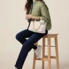 Jeans regular blu rinse con bottoni dorati
