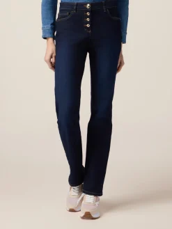 Jeans regular blu rinse con bottoni dorati