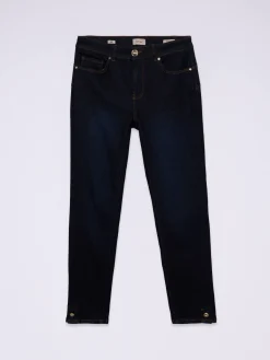 Jeans skinny blu rinse con bottoni sul fondo gamba