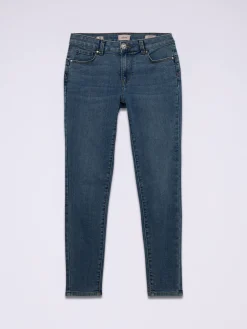 Jeans skinny con bottone gioiello