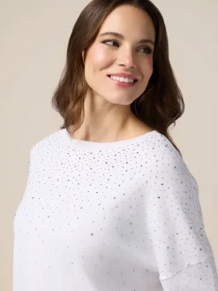 Maglia con pioggia di borchiette/strass