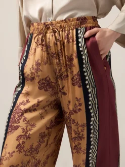 Pantaloni palazzo in raso fantasia