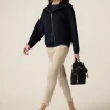 Pantaloni skinny in cotone e tencel con bottone gioiello