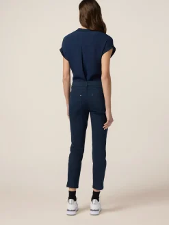 Pantaloni skinny in cotone e tencel con bottone gioiello