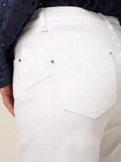 Pantaloni skinny in cotone e tencel con bottone gioiello