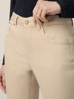 Pantaloni skinny in cotone e tencel con bottone gioiello