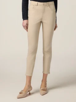 Pantaloni skinny in cotone e tencel con bottone gioiello