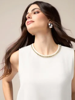 Top fluido con applicazioni decorative