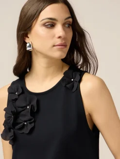 Top in jersey con applicazioni floreali