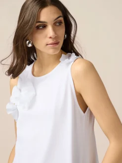Top in jersey con applicazioni floreali