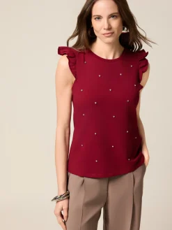 Top in jersey con castoni