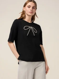 T-shirt con fiocco in strass