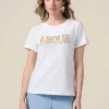T-shirt con patch gioiello