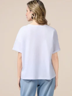 T-shirt con tasca in denim e paillettes