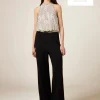 Tuta bimaterica con top in paillettes