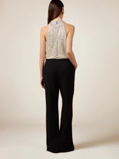 Tuta bimaterica con top in paillettes