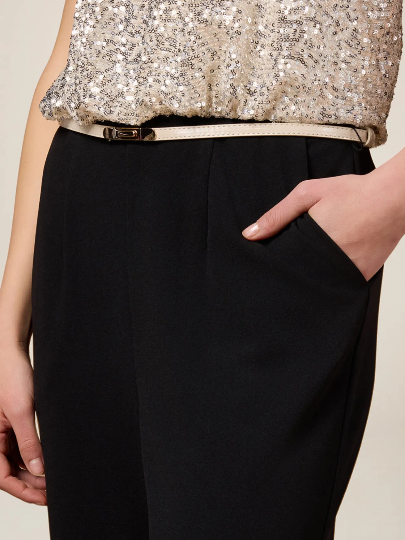 Tuta bimaterica con top in paillettes